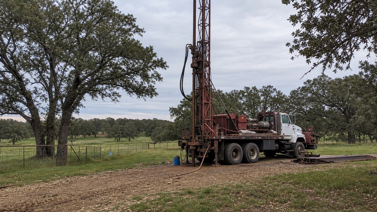 Fayette County Texas ranch drilling site and water well service equipment Fayette County Texas ranch drilling site with water well rig and service truck