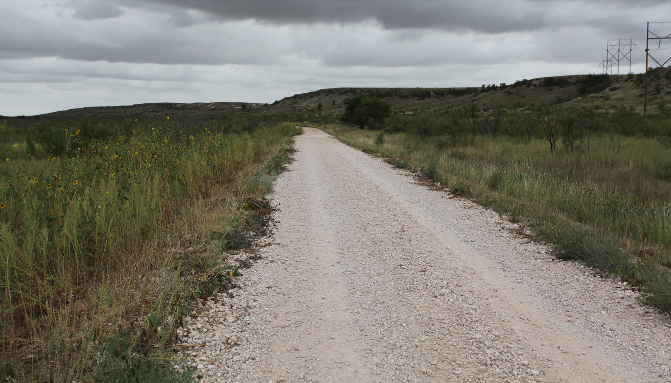 West Texas High Plains ranch access road and overhead utility corridor for property-access review